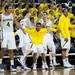 The Michigan bench erupts after a score in the remaining minutes of the game against IUPUI on Monday. Michigan won 91-54. Daniel Brenner I AnnArbor.com